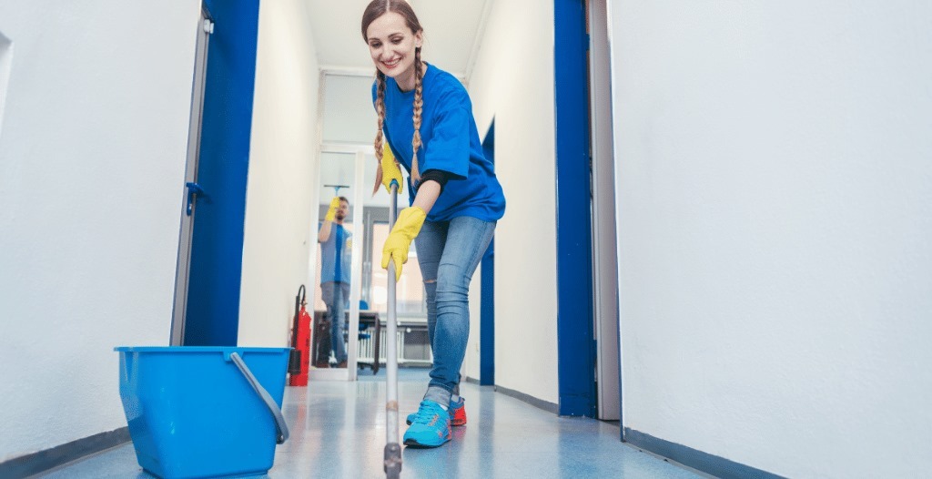 benefits of commercial cleaning services. A BusinesscleaningofIowa lady worker cleaning the floor